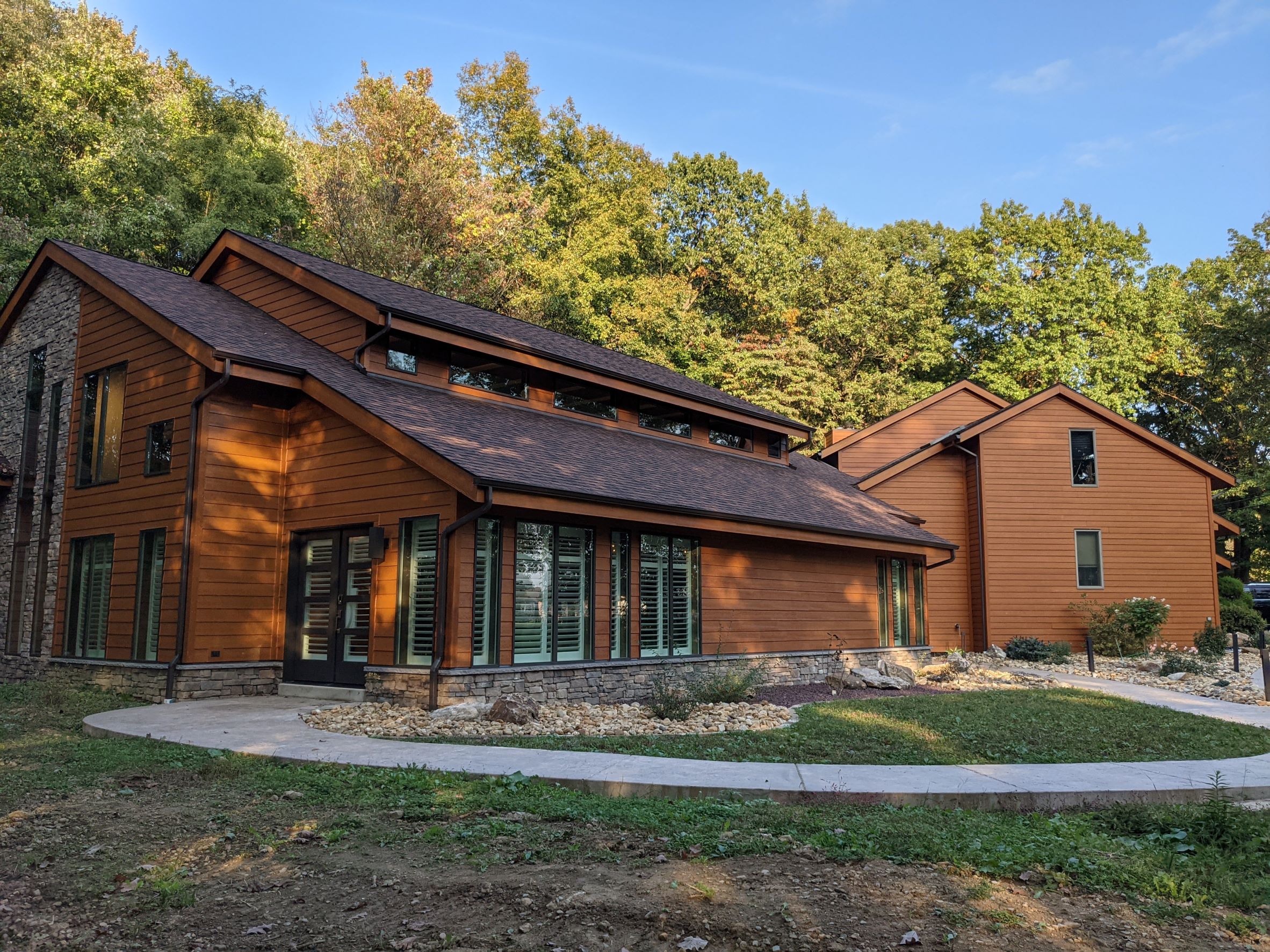 Exterior View of Contemporary House addition with stone, wood siding for an indoor pool outside of Pittsburgh Pennsylvania
