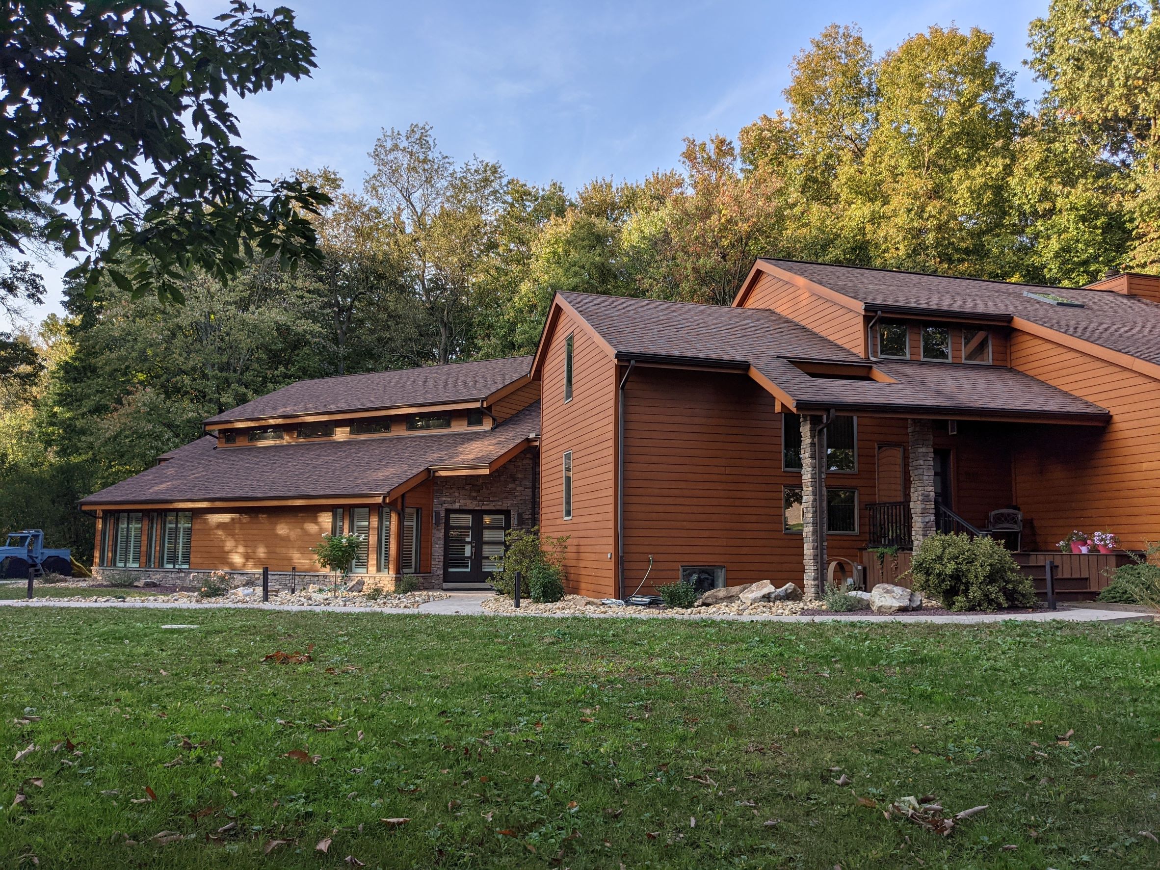 Exterior View of Contemporary House addition with stone, wood siding for an indoor pool outside of Pittsburgh, PA